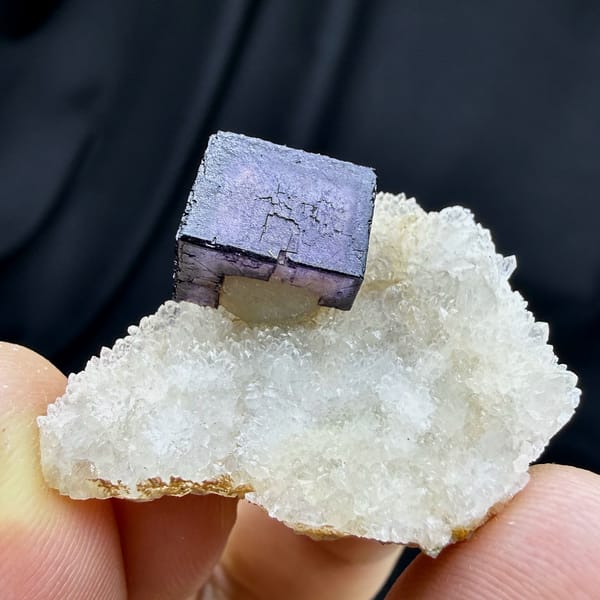 Blue-rimmed purple fluorite cube on white quartz from Inner Mongolia, China, reverse side