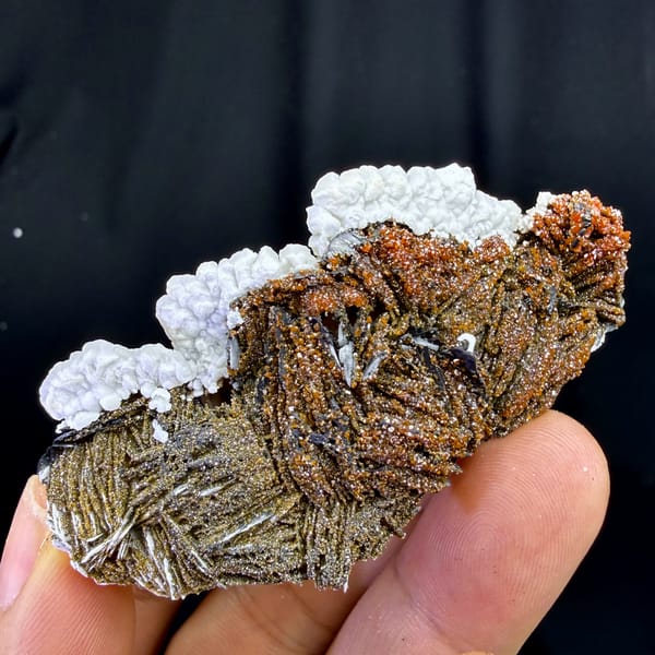 Red vanadinite on brown baryte with white aragonite from Morocco, reverse side