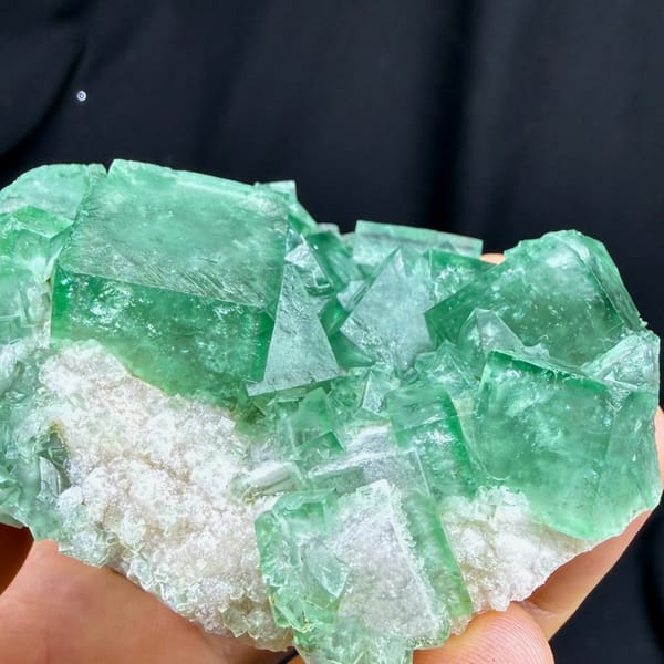 Sea-green daylight fluorite cubes on white quartz from Madagascar, top view