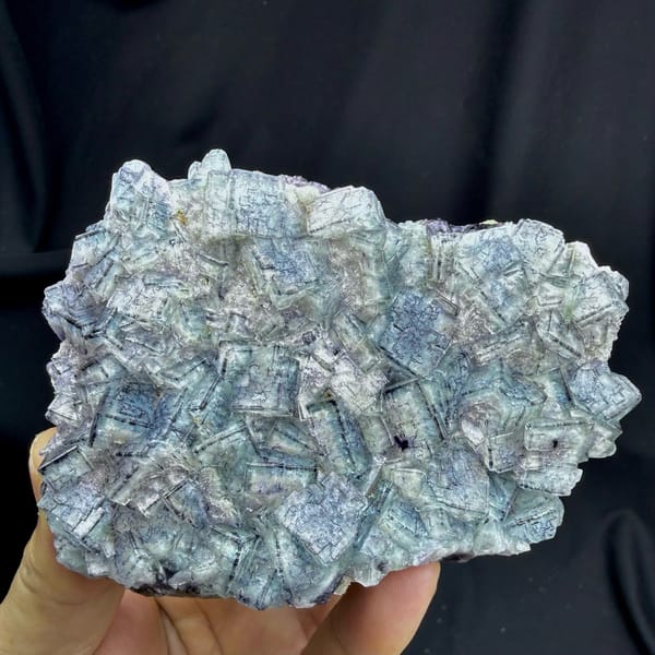 Plate of blue-and-white porcelain fluorite cubes from Inner Mongolia, China, detail of the matrix contact