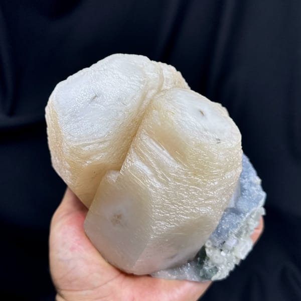 Huge cream calcite prisms with green fluorite and quartz from Fujian, China, close-up of the crystal faces