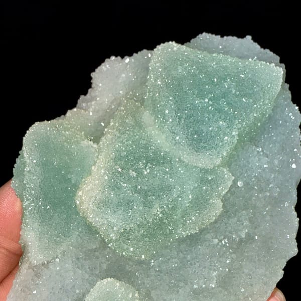 Mint-green sugar-textured octahedral fluorite plate from Fujian, China, close-up of the crystal faces