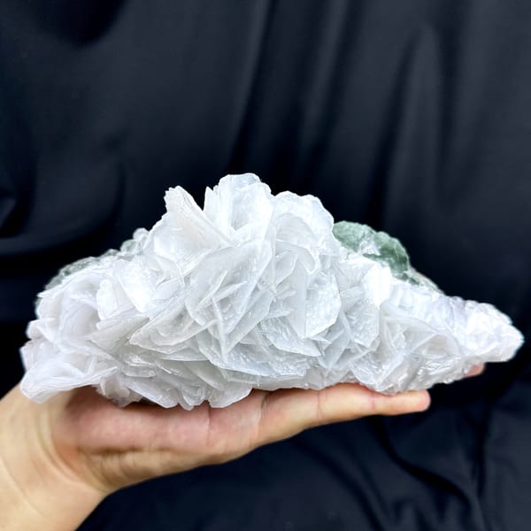 Large rose of white bladed calcite with green fluorite from Hunan, China, close-up of the crystal faces
