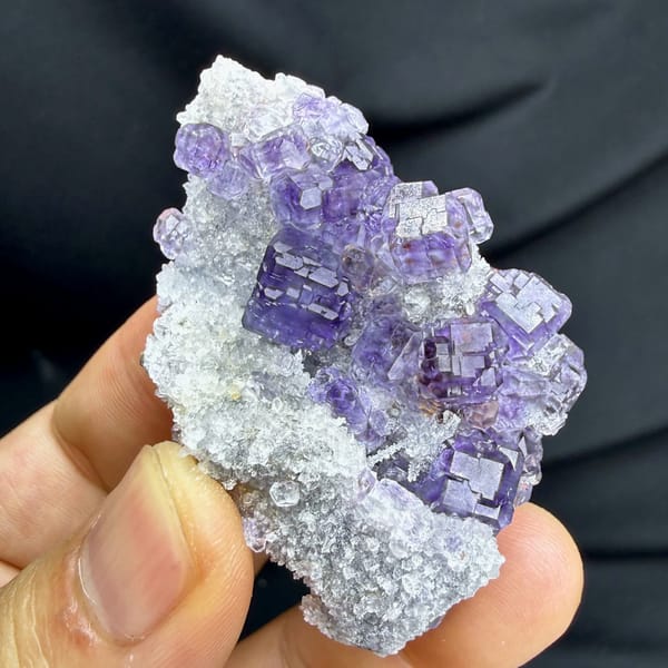 Violet-blue fluorite cubes on white quartz from Fujian, China, reverse side
