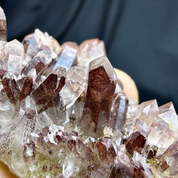 Row of clear quartz points with red hematite phantoms from Shanxi, China, top view
