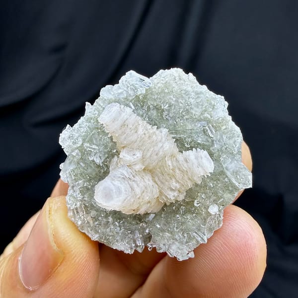 Stacked pagoda calcite tower on quartz needles from Fujian, China, close-up of the crystal faces