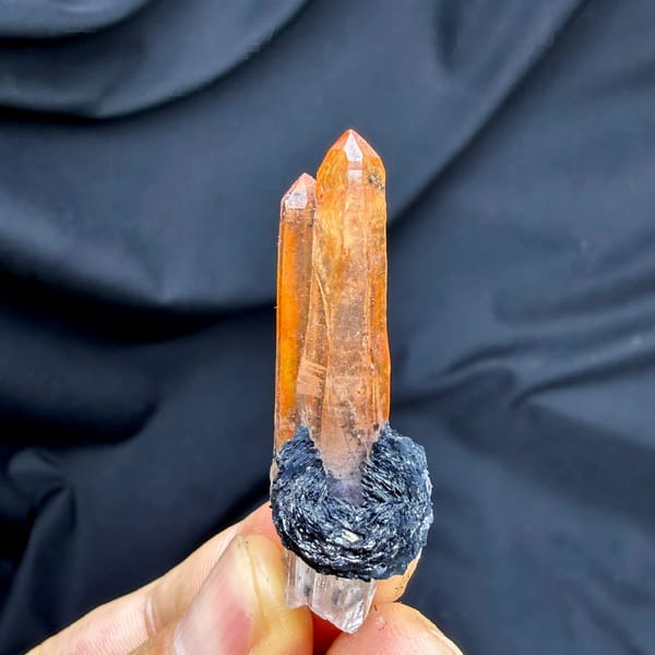 Flame-orange hematoid quartz crystal on black specular hematite from Guangdong, China
