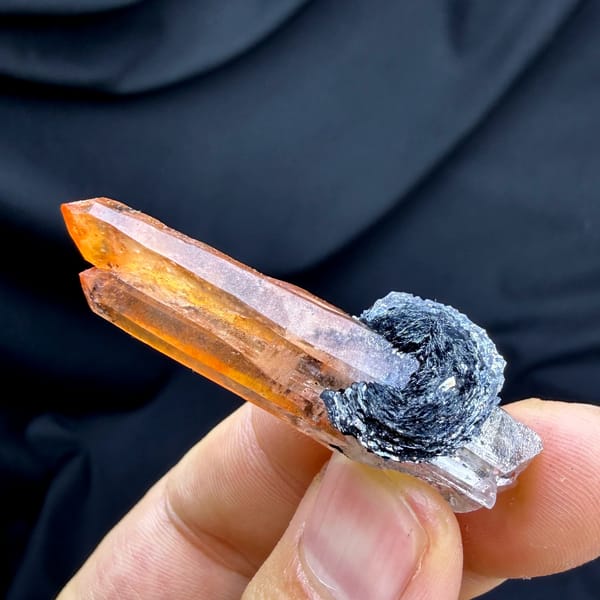 Flame-orange hematoid quartz crystal on black specular hematite from Guangdong, China, second angle