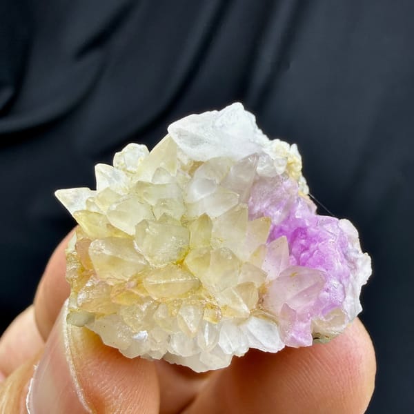 Yellow dogtooth calcite with pink cobalt aragonite from Yunnan, China, detail of the matrix contact