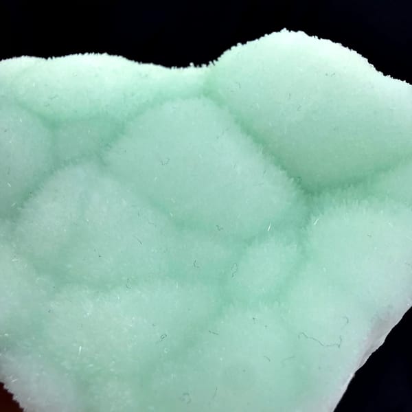 Pastel-green botryoidal aragonite plate from Yunnan, China, top view