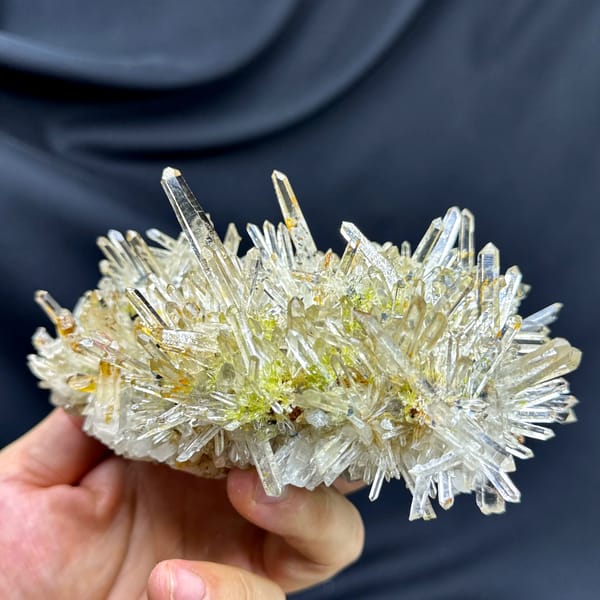 Burst of clear quartz needles with epidote and specular hematite from Guangdong, China, second angle