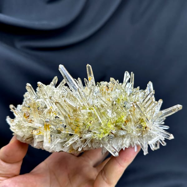 Burst of clear quartz needles with epidote and specular hematite from Guangdong, China, reverse side