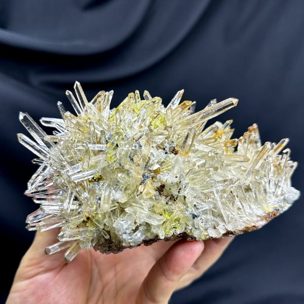 Burst of clear quartz needles with epidote and specular hematite from Guangdong, China, top view