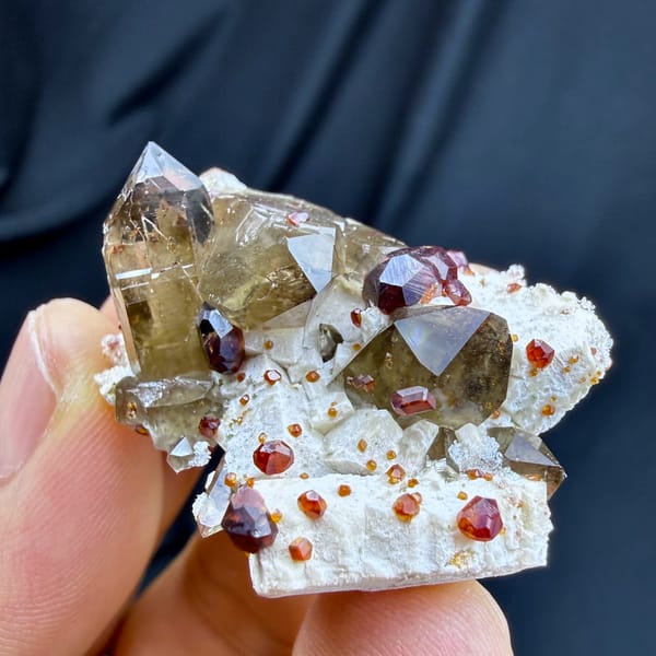 Smoky quartz with red garnets and hyalite opal on feldspar from Yunxiao, Fujian, China, top view