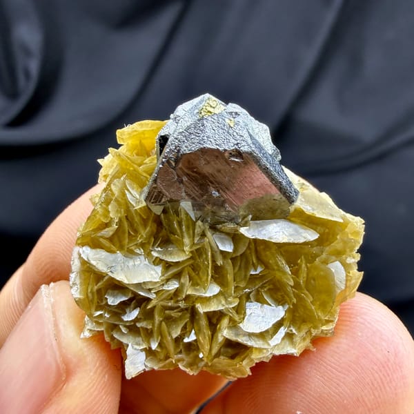 Steel-grey tetrahedrite crystal on golden siderite with chalcopyrite from Guizhou, China, second angle