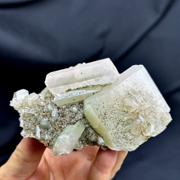 Large pink and green two-tone apophyllite crystals from Fujian, China, close-up of the crystal faces