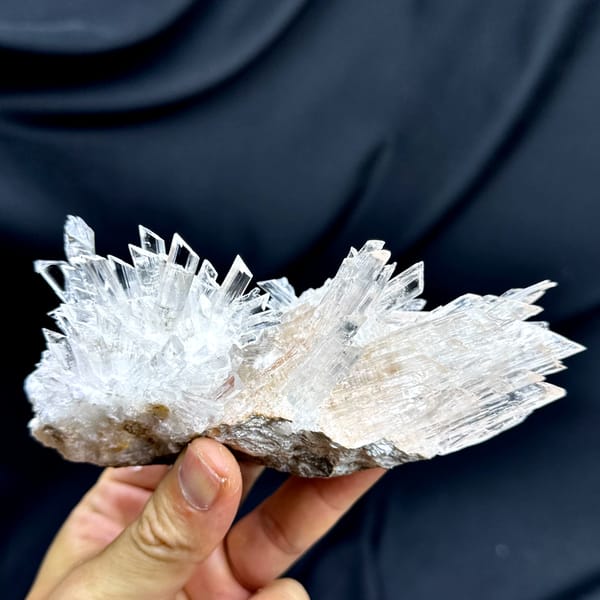 Long fan of transparent gypsum prisms from Guizhou, China, reverse side