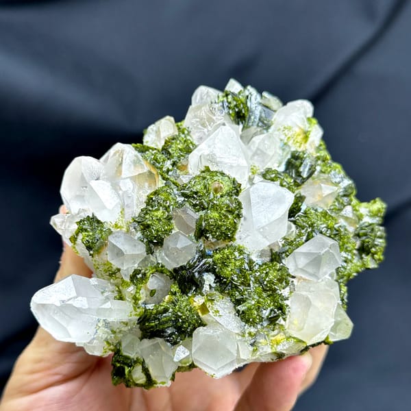 Green botryoidal epidote between milky garden quartz crystals from Sichuan, China, top view