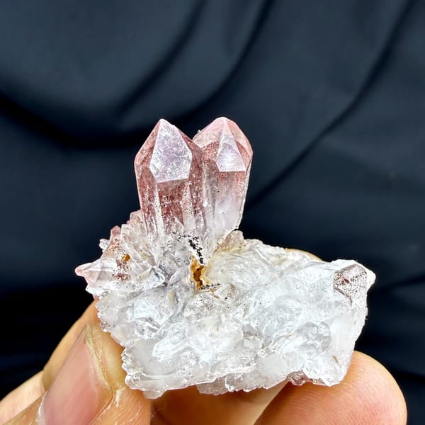 Strawberry-red phantom quartz crystal on white druse from Shanxi, China, top view