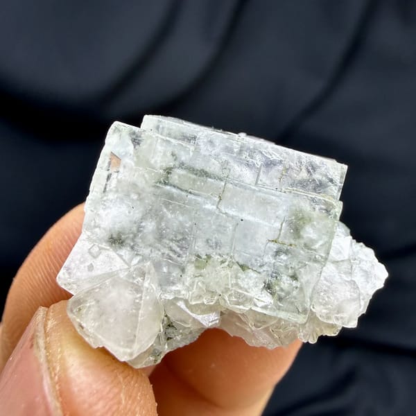 Colourless fluorite cubes with scheelite and mica from Yaogangxian Mine, Hunan, China, close-up of the crystal faces
