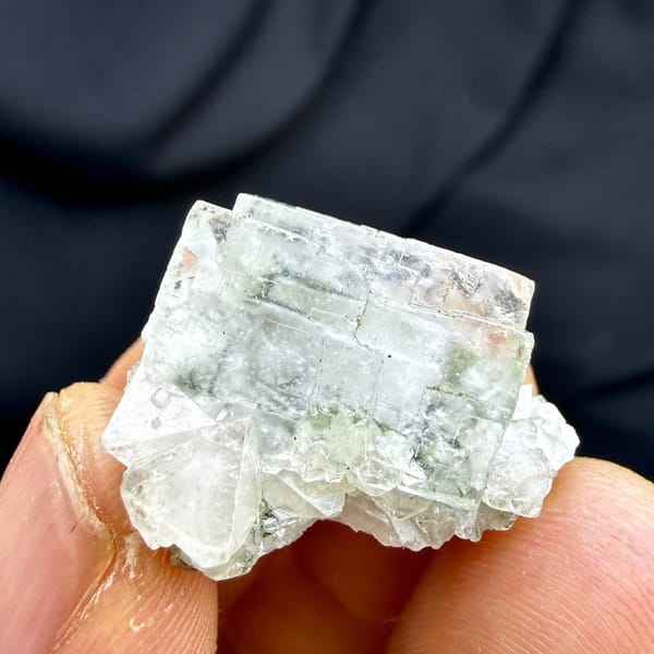 Colourless fluorite cubes with scheelite and mica from Yaogangxian Mine, Hunan, China, detail of the matrix contact