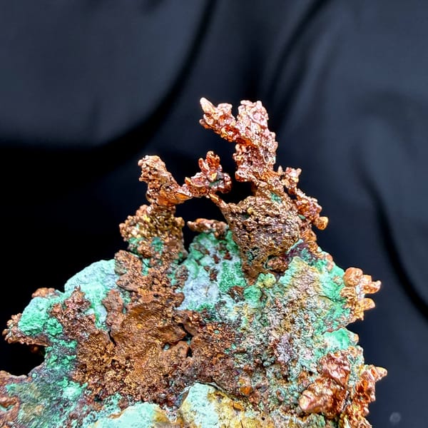 Dendritic native copper with turquoise malachite from the USA, close-up of the crystal faces