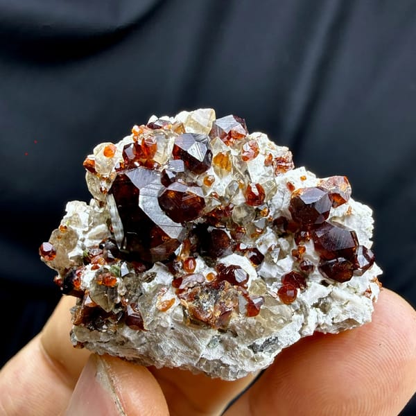 Large dark-red garnet crystals on feldspar and smoky quartz from Yunxiao, Fujian, China