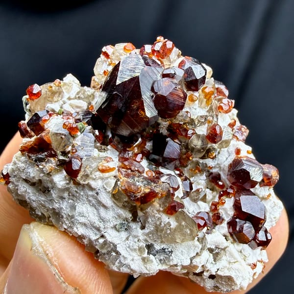 Large dark-red garnet crystals on feldspar and smoky quartz from Yunxiao, Fujian, China, reverse side