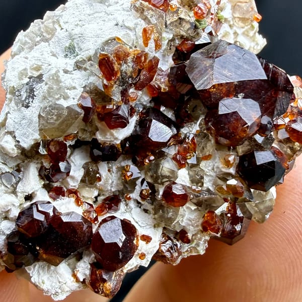 Large dark-red garnet crystals on feldspar and smoky quartz from Yunxiao, Fujian, China, top view
