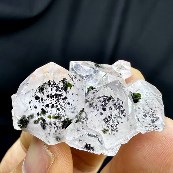Clear quartz crystals with black-green epidote inclusions from Sichuan, China, top view