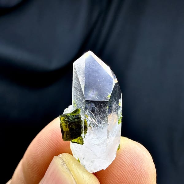 Small clear quartz point with green epidote from Sichuan, China, detail of the matrix contact