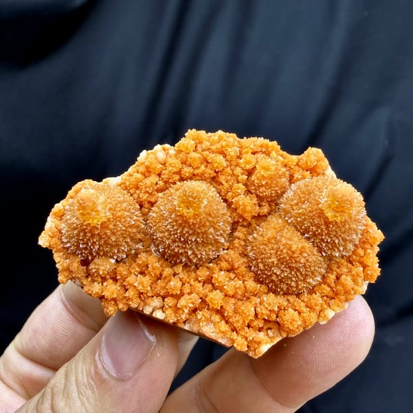 Orange gourd-shaped stalactitic calcite from Yunnan, China, reverse side