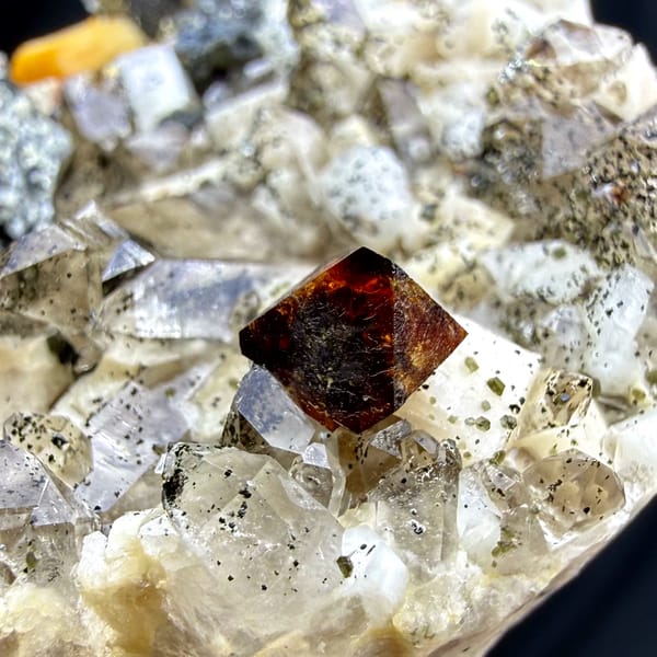 Red-brown helvine crystals on smoky quartz and feldspar from Yunxiao, Fujian, China, second angle