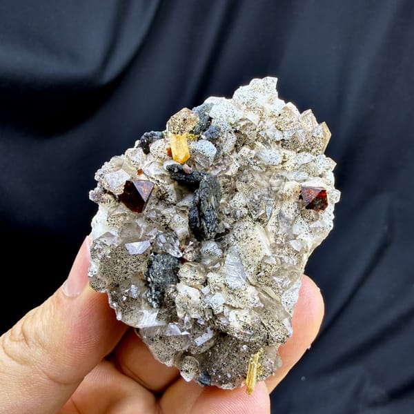 Red-brown helvine crystals on smoky quartz and feldspar from Yunxiao, Fujian, China, reverse side