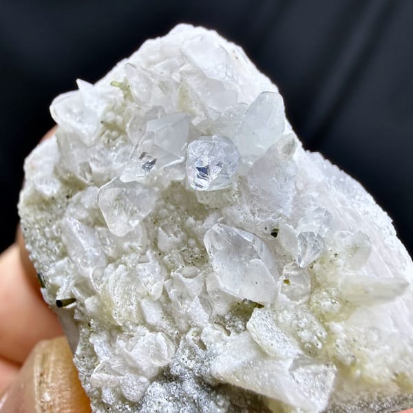 Pale pink feldspar crystal capped with quartz druse and mica from Pakistan, reverse side