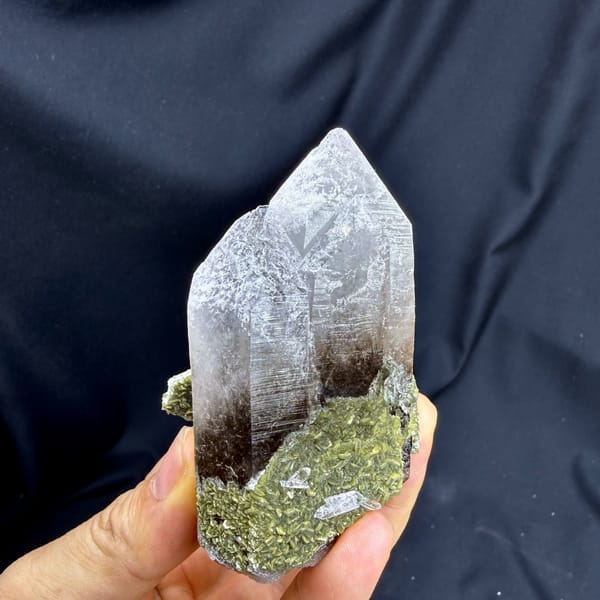 Large gradient quartz crystal with snowflake inclusions and green fluorite from Yunxiao, close-up of the crystal faces