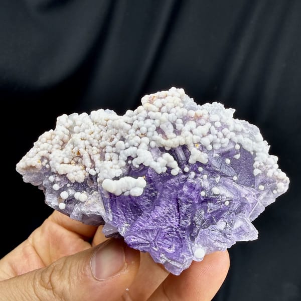 Lavender fluorite with white botryoidal aragonite from Yunnan, China, close-up of the crystal faces