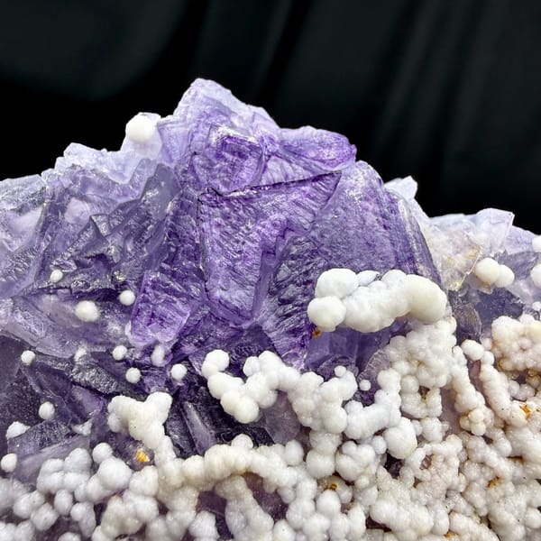 Lavender fluorite with white botryoidal aragonite from Yunnan, China, reverse side