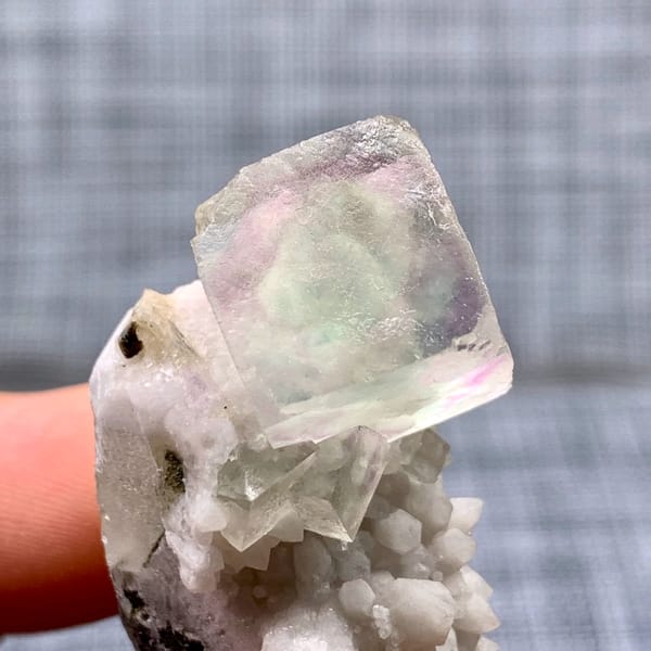 Purple-green fluorite cube on a pale quartz stalk from Inner Mongolia, China, second angle