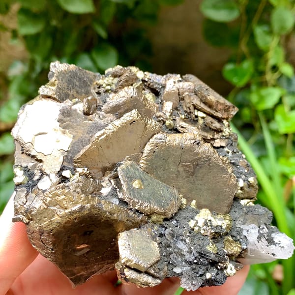 Stacked bronze pyrrhotite plates with chalcopyrite and quartz from Inner Mongolia, China, close-up of the crystal faces
