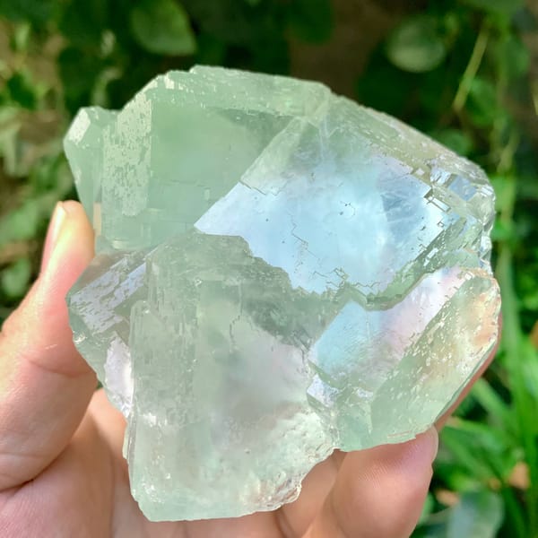 Large transparent green fluorite cube cluster from Fujian, China, close-up of the crystal faces