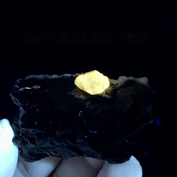 Pale yellow cerussite crystal on dark galena matrix from Guangxi, China, second angle