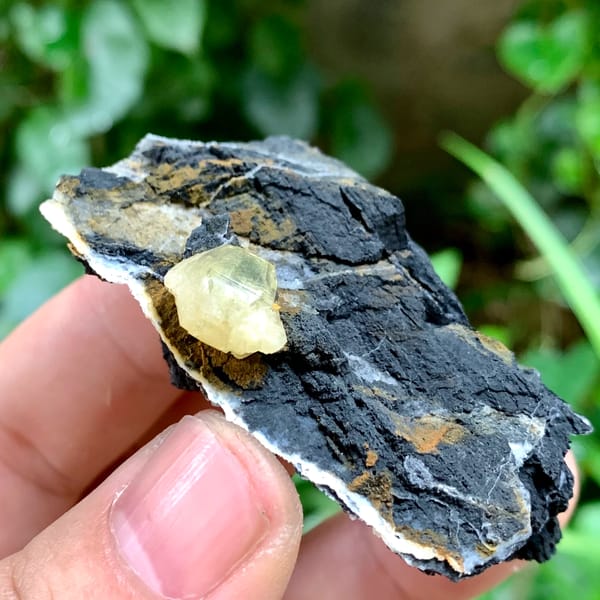 Pale yellow cerussite crystal on dark galena matrix from Guangxi, China, reverse side