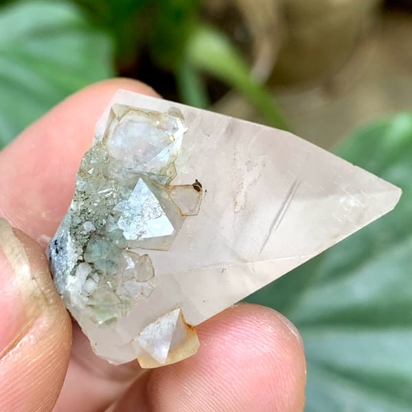 Milky calcite point with pale green fluorite octahedra from Fujian, China, reverse side