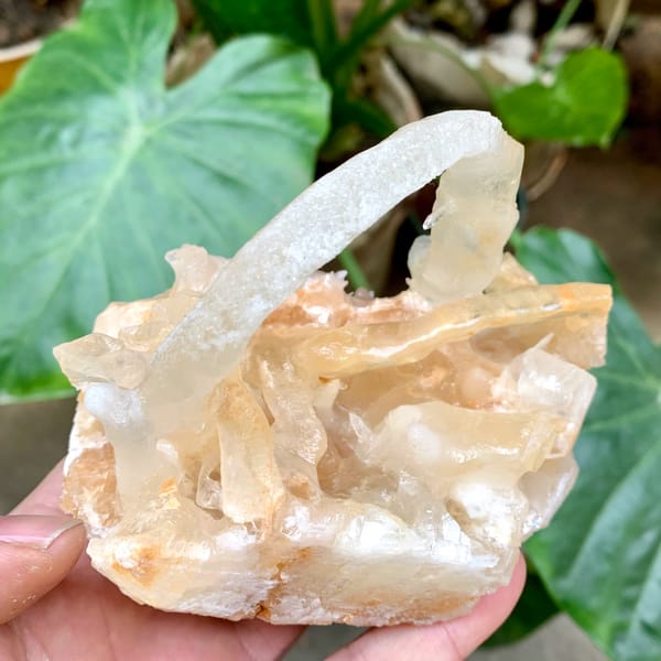 Arched calcite stalactite over crystal cluster from Yunnan, China, reverse side