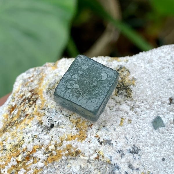Single green fluorite cube on pale quartz matrix from Inner Mongolia, China, second angle
