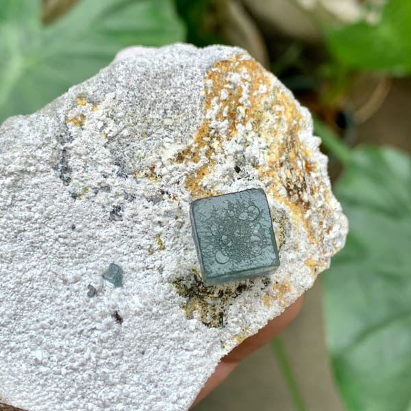 Single green fluorite cube on pale quartz matrix from Inner Mongolia, China, top view