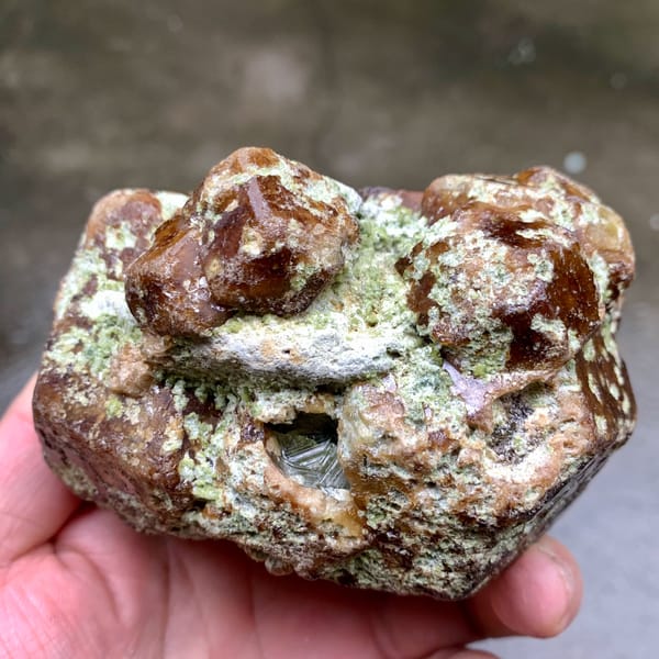 Large brown-green demantoid garnet crystal floater from Mali, second angle
