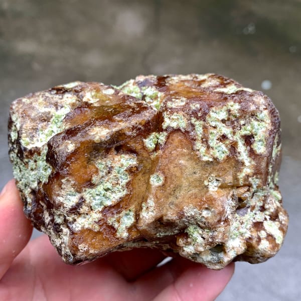Large brown-green demantoid garnet crystal floater from Mali, reverse side