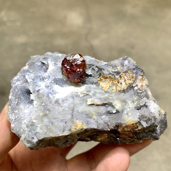 Gem-grade sphalerite crystal glowing orange-red when, from Hunan, China, close-up of the crystal faces